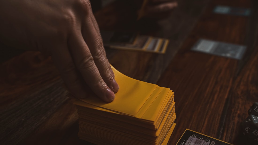 A card being placed face down on a table